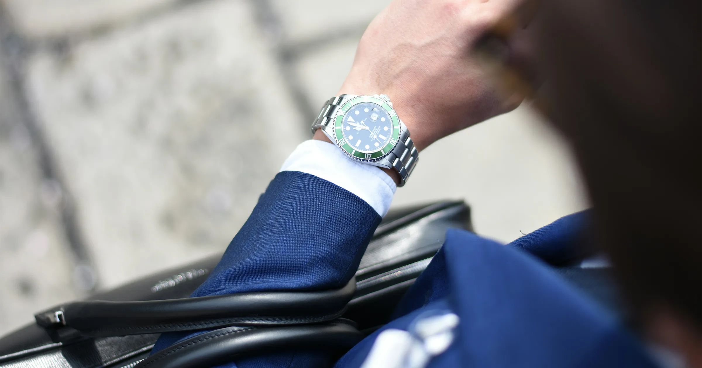 Business man looking at watch