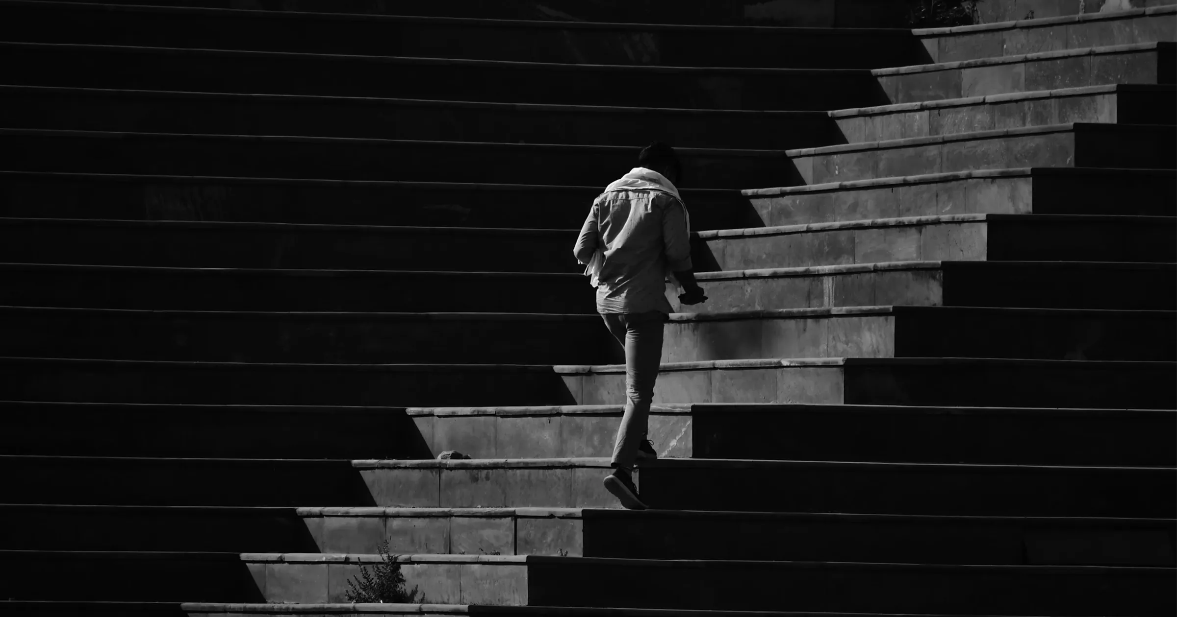 Man climbing up stone stairs