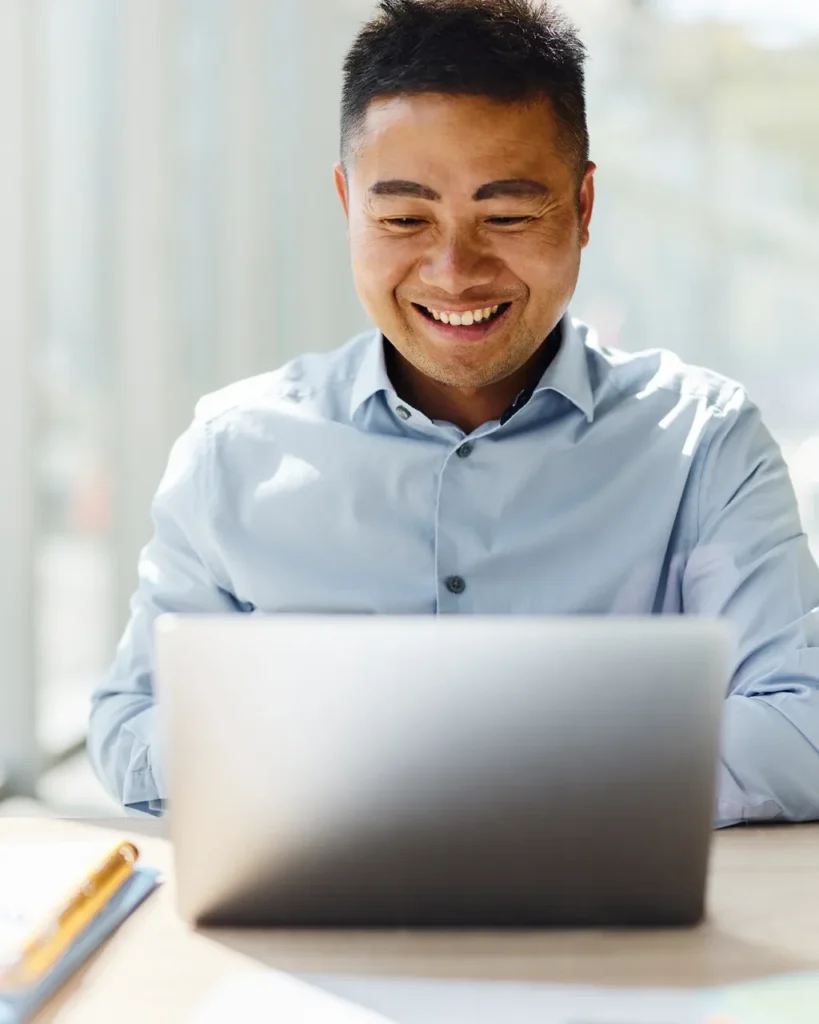 Practice administrator watching a webinar on a laptop